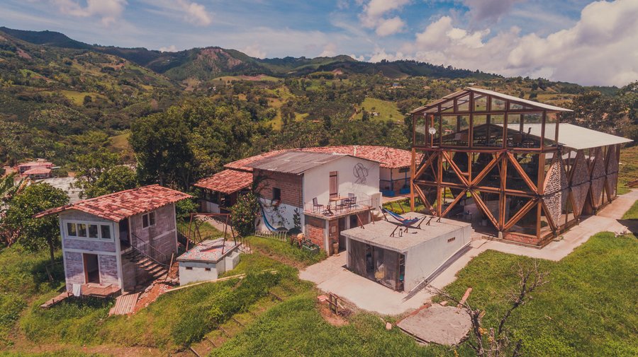 Overview of coworking space, hammock area, café and some rooms