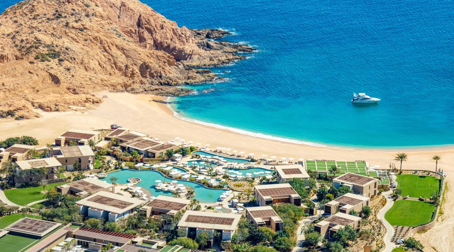 Aerial view of the resort pools and beach area
