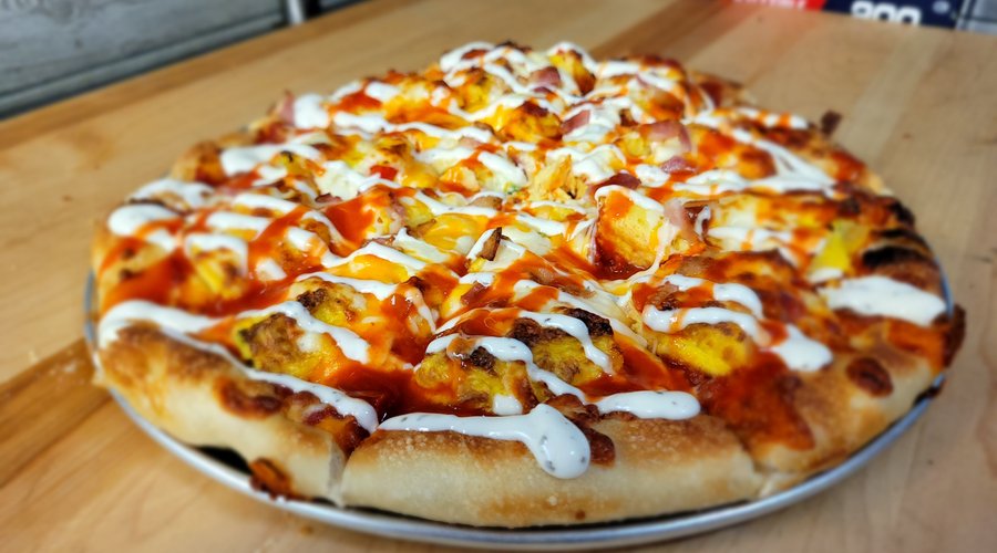 Breakfast Pizza
Oven baked eggs, Ham or Bacon, Cheddar 
add your favorite toppings.
drizzle with hot sauce, ranch