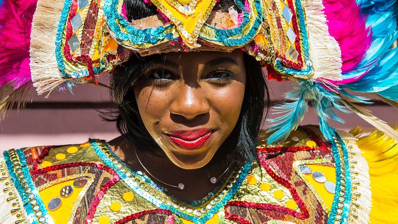 Woman posing in a colorful Carnival costume at Junkanoo