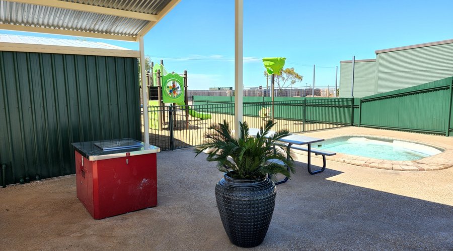 Enjoy a BBQ and keep an eye on the little ones in the wading pool and on the playground