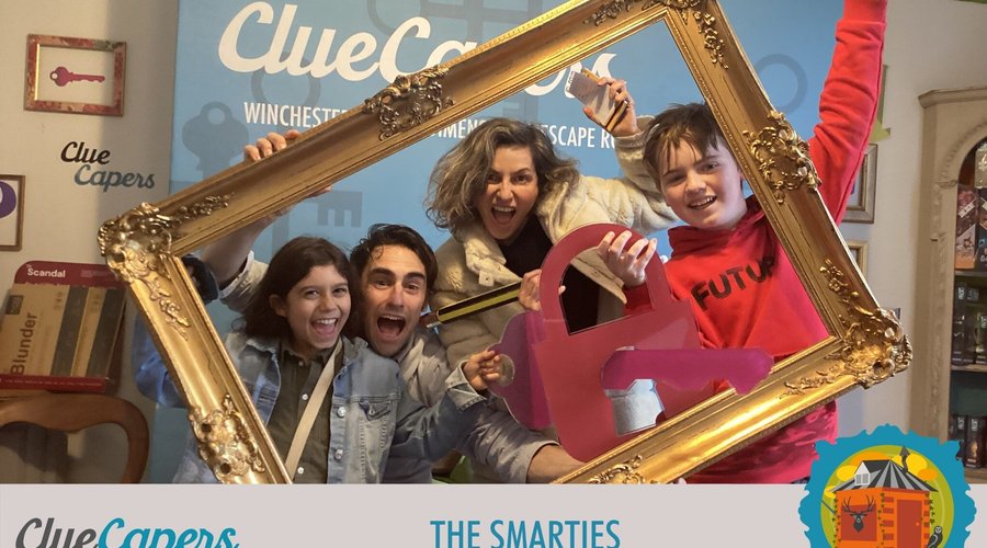Family group celebrating their escape; team name is The Smarties.