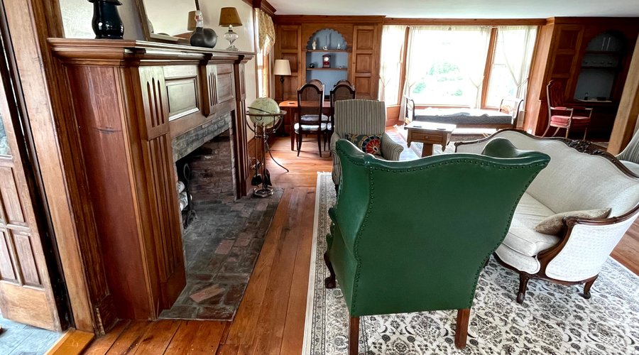 Common area with fireplace and access to sun porch.