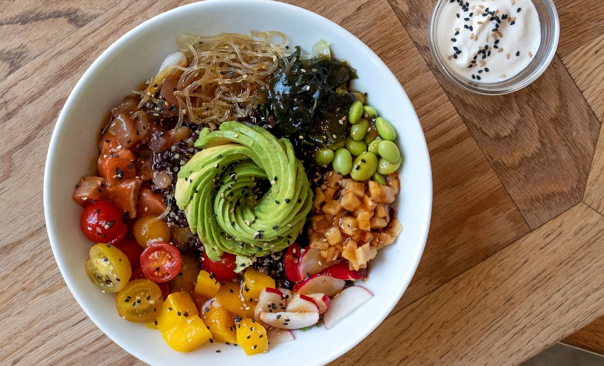 YELLOWFIN TUNA & SALMON POKE BOWL: yellowfin tuna + Alaskan wild salmon + black rice + white quinoa + avocado + wakame seaweed + fermented celery+ kelp noodles + edamame + leafy greens + miso-ginger dressing