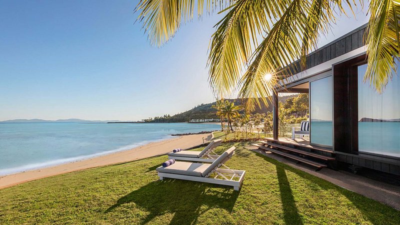 Lounge chairs outside the King Beachfront Pavilion at the Intercontinental Hayman Island Resort