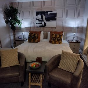 Our superior double with heated beds, remote controlled lighting, smart TV, toiletries, en-suite, seating area, alarm clock, wireless charger and free breakfast hamper