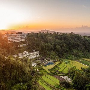 Aerial view of HOMM Saranam Baturiti. A brand by Banyan Tree Group, a rejuvenating retreat surrounded by cool mountain air, green open spaces, and farms growing produce on fertile volcanic soil.