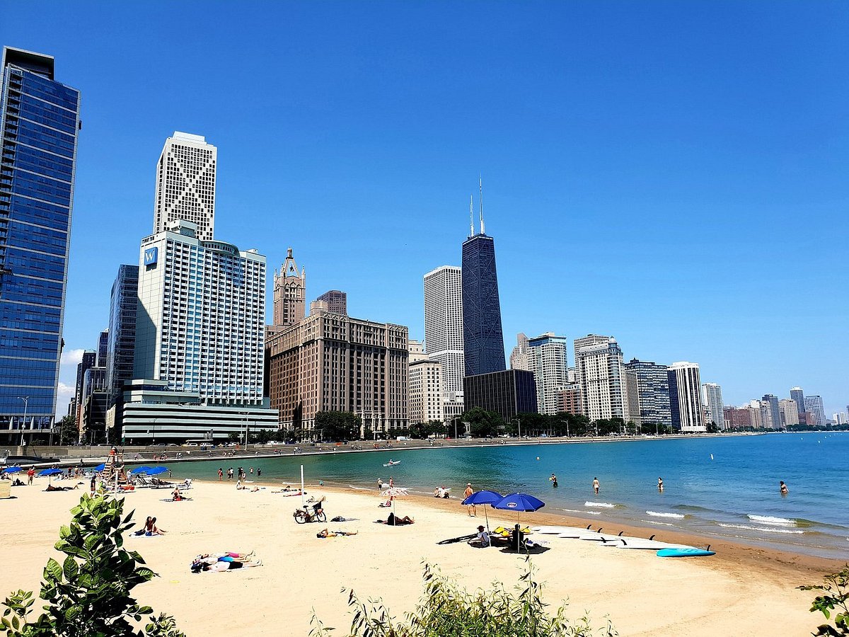 The Chicago skyline behind a sandy beach on the shores of Lake Michigan