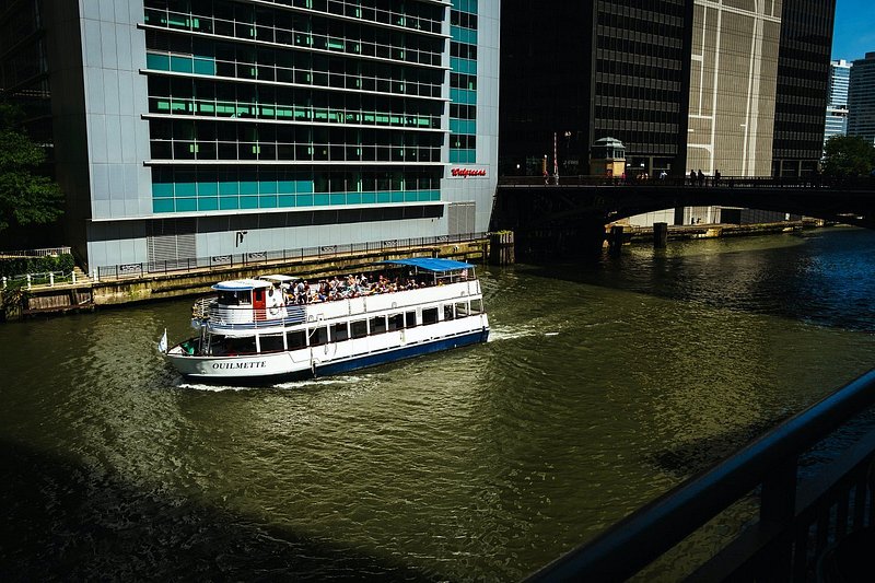 A boat navigates the Center River for the Chicago Architecture Cruise 
