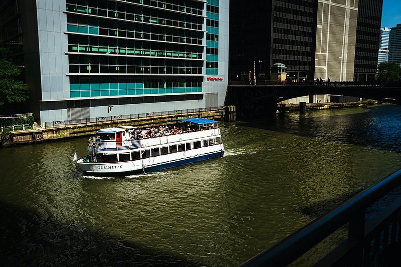 A boat navigates the Center River for the Chicago Architecture Cruise