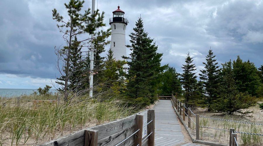 PHOTO FROM 2022 SHOWING BOARDWALK LEADING TO LIGHTHOUSE.
