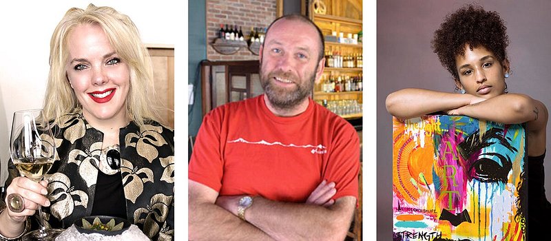 Left: Loftus smiling and holding glass of white wine; Center: Devoy smiling, wearing red shirt, with arms crossed; Right: Finnie with crossed arms atop piece of colorful canvas artwork