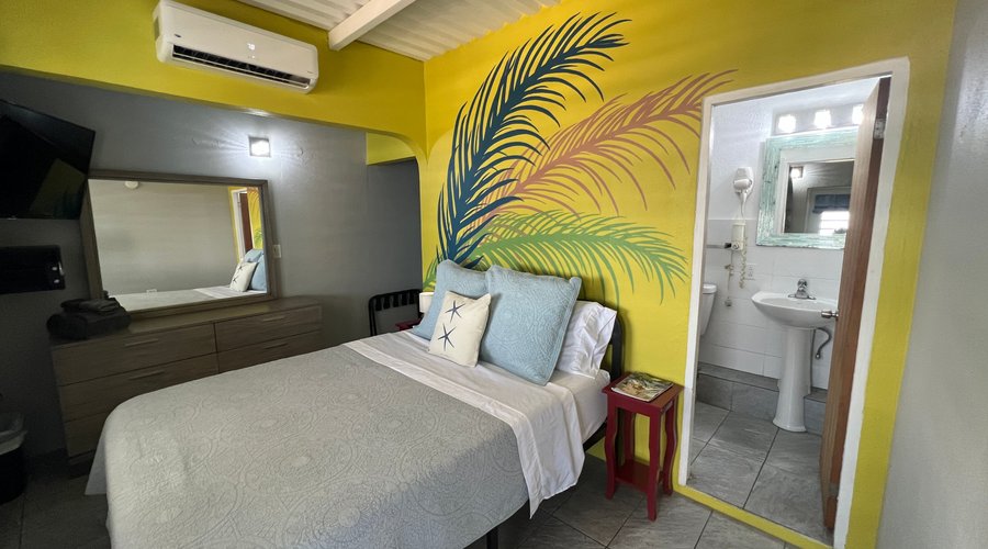 Room #9 with one queen size bed & ocean view.  3rd floor is for adults only.