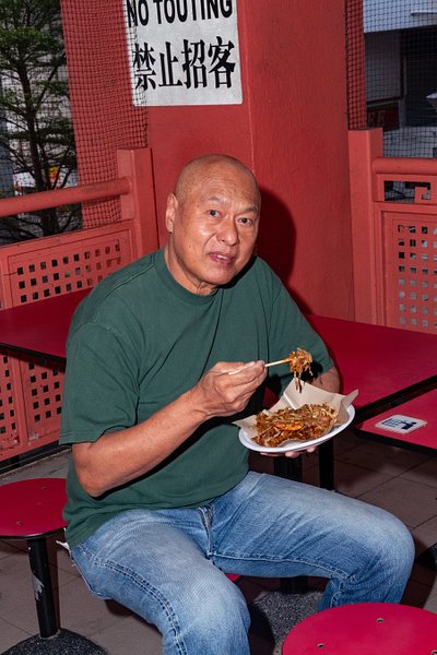 A portrait of Damian D'Silva, founder of Rempapa and MasterChef Singapore judge, at Chinatown Complex Food Centre