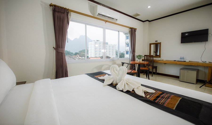 The Standard Room is a simple yet comfortable room with an area of 25 m2, featuring a double or twin bed and a city view.

The private bathroom comes with a shower, providing guests with a convenient and enjoyable stay.