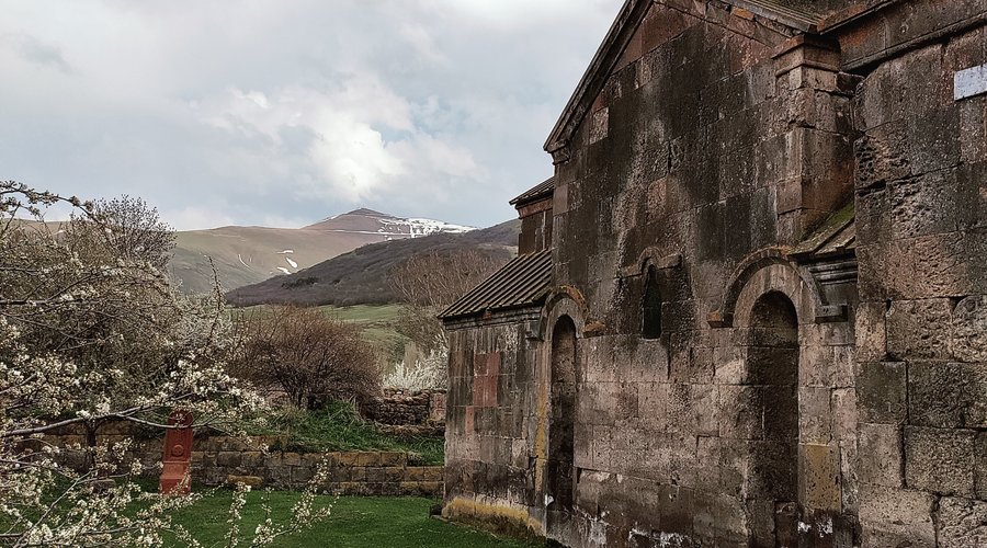 Side view of the complex, with the still snow-capped mountains in the background.