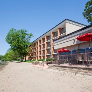 700' of Sandy beach with patio seating for dining