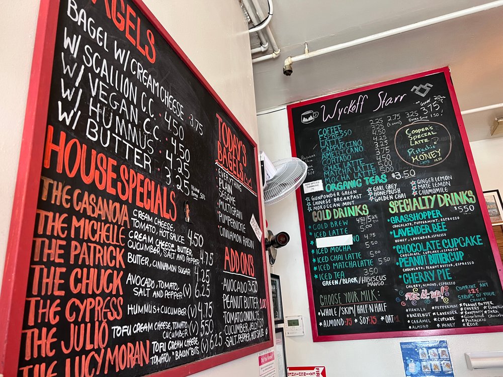 Chalkboard menu inside Wyckoff-Starr Coffee Shop in Bushwick, Brooklyn, highlighting their specialty coffee offerings.