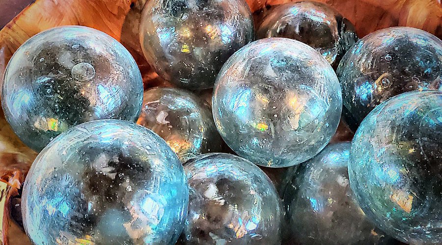 Blown glass old fishing net floats.