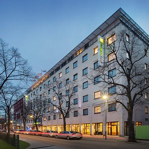 Holiday Inn Express on a broad, tree-lined boulevard in Berlin.