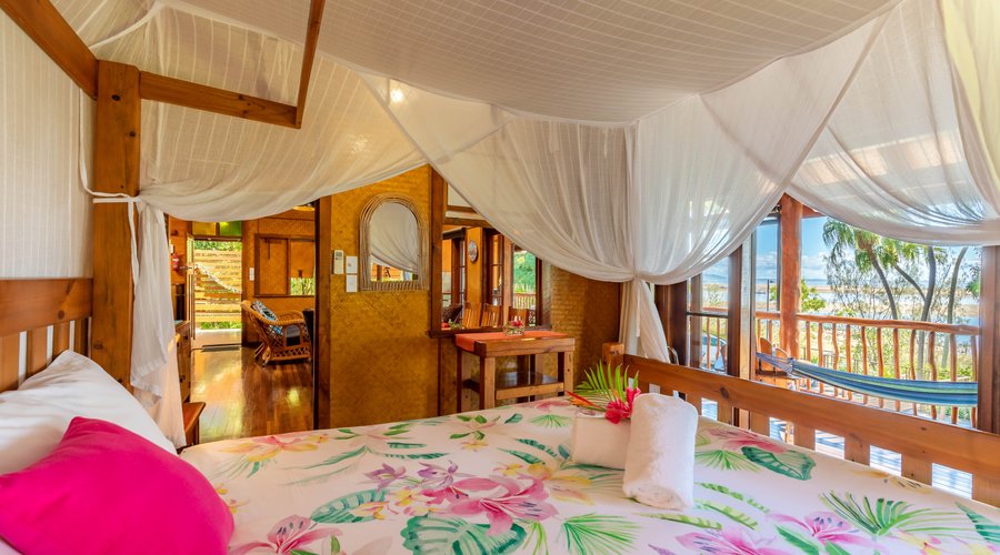 Sunset Bungalow - Main bedroom looking to deck and beach in front.