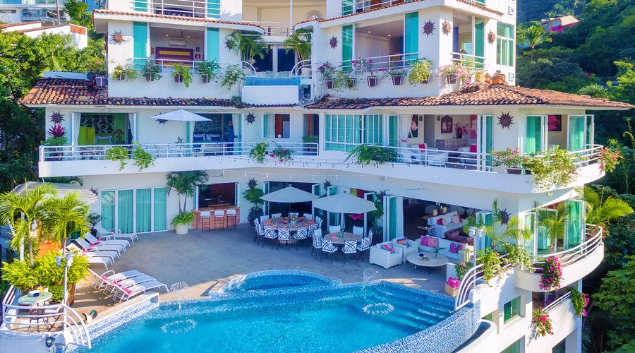 27000 Sq. Ft. Indoor/outdoor living space
14 Bedrooms w/AC, TV & ensuite Bath
 Infinity pool & poolside Jacuzzi
Full Staff 5 Star Service
2 LIving areas, plus Game Arcade
Gym onsite
Personal Concierge for all guest services
Location short walk Romantic Zone & Beach