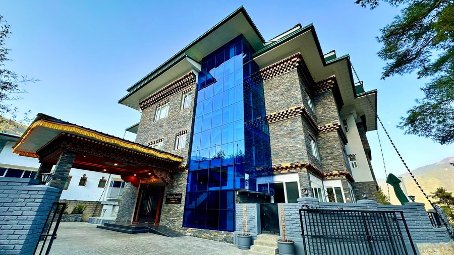 Bhutan Peaceful Residency & Spa,  situated in a blue pine forest in  the upper reaches of Thimphu  Valley is a family run premium  3 star boutique hotel located  close to the capital’s sights such  as, Sangay-gang, Takin Reserve  center, while remaining in a quiet  retreat away from the hustle and  bustle of the Kingdom’s main  commercial center.