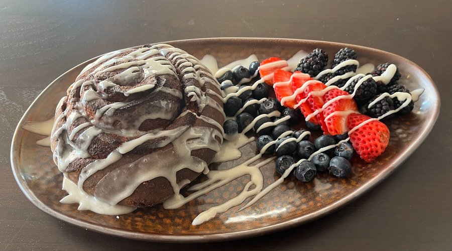 Cinnamon Roll - Classic Homemade Cinnamon Roll Served with a Side of Fruit