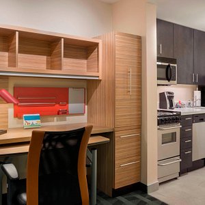 One-Bedroom Suite – Desk and Kitchen Area