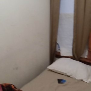 nasty stained walls and ruined curtains.