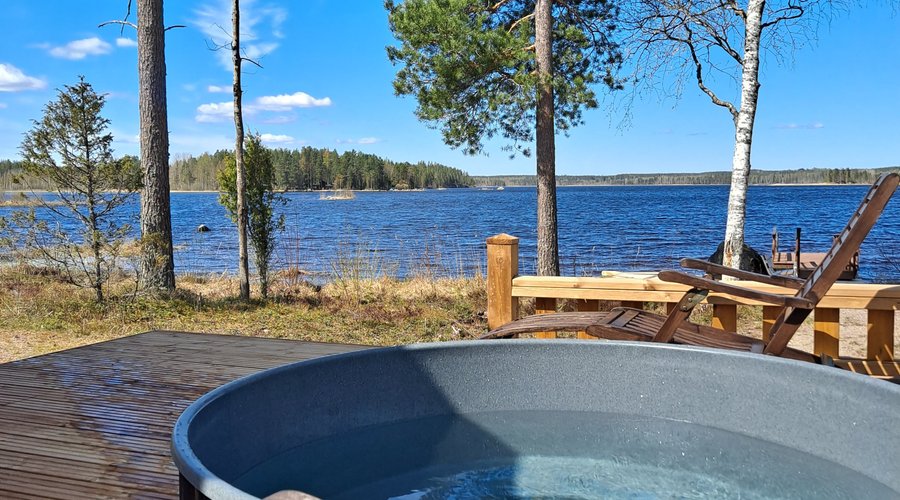 the terrace of lakeshore sauna with hot tub (palju) and summer furniture 
Available upon request