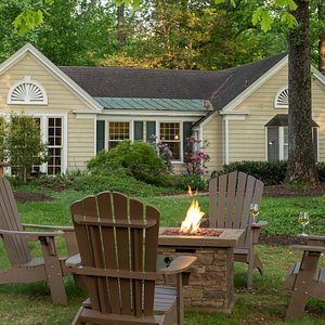 Foxfield Inn grounds with adirondack chairs and fire pit