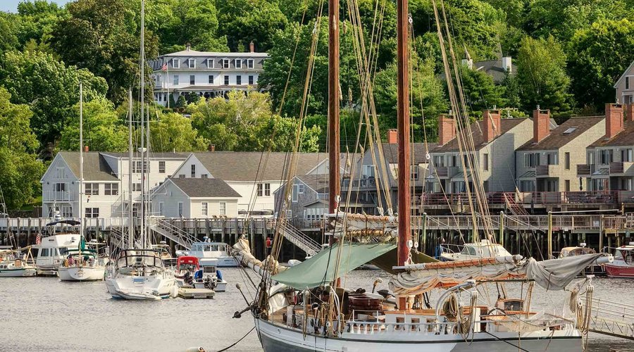 Relais and Chateaux Camden Harbour Inn and Natalie’s Restaurant overlooking Camden Harbor and Camden Hills including Mount Battie . Located across the yacht club the inn offers 20 guest rooms and suites, a private 3 bedroom / 2 bathroom villa and Natalie’s Restaurant. Both awarded  AAA 4 diamonds.