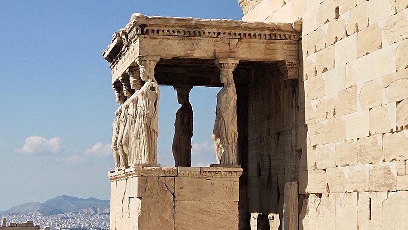 Female statue pillars look off into the distance at the Temple of Athena Nike
