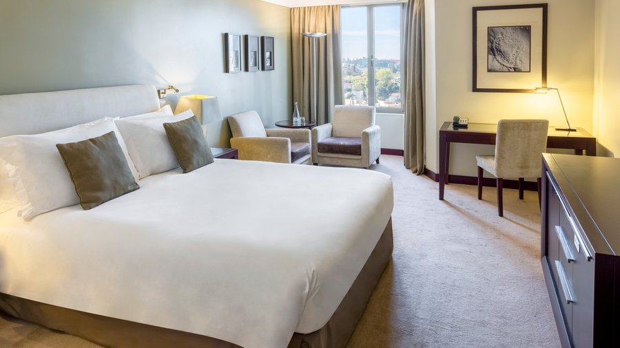 Spacious standard king room with city view, lounge and work areas, perfect for leisure or business travelers.
Complimentary Wifi and bottle of water.
Flat TV, Minibar, Tea and Coffee Facilities, Safe, Iron Board, Hairdryer.