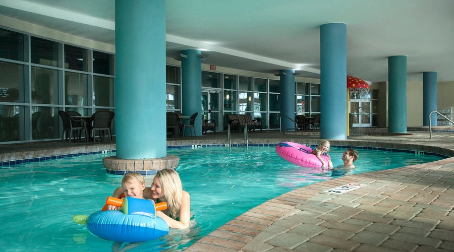 Family in indoor pool