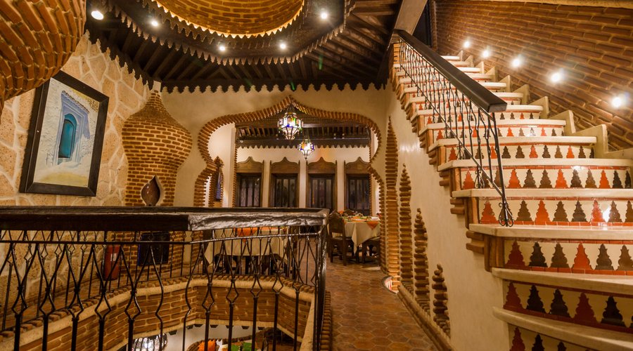 Sip on a fragrant cup of coffee while taking in the panoramic views of Chefchaouen, making every moment at La Lampe Magique Casa Aladin a truly enchanting experience.