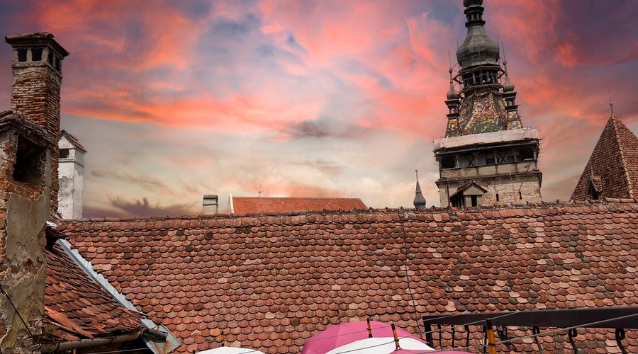 🏰✨ Greetings from Medieval Cafe Sighisoara! ✨🏰  🌟 Capture the essence of history and charm at our one-of-a-kind terrace! 🌟  🏰 Feast your eyes on the breathtaking view of the iconic Sighisoara Clock Tower from our enchanting terrace! 😍🕰️  🍃🍂 Enjoy a medieval journey with every sip and bite, surrounded by the beauty of Sighisoara's medieval architecture! 🍃🏰