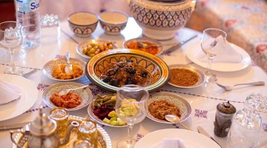 The best variety of Moroccan salads, beef tagine with almonds and prunes, soup harira and refreshing mint tea. 