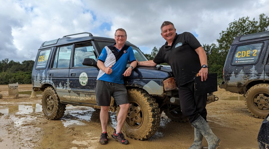 Our fantastic instructor Mark, and a very muddy Land Rover!