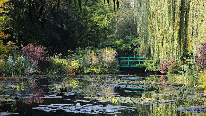 Water lily pond and bridge in autumn at Monet’s Garden in Giverny, France