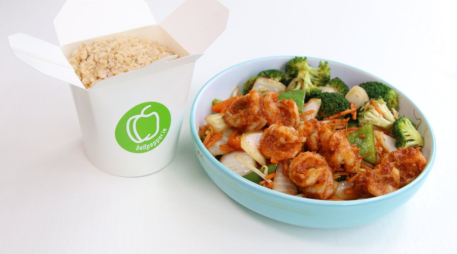 Spicy Wok Fried Thai Prawns-  Jumbo prawns seared with Thai herbs and chilli on a bed of stir -fried vegetable. 