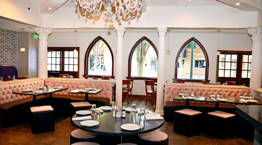 Step into a captivating dining space adorned with elegant pillars at our restaurant. Enjoy your meal at round tables that foster intimate conversations in a truly charming ambiance.