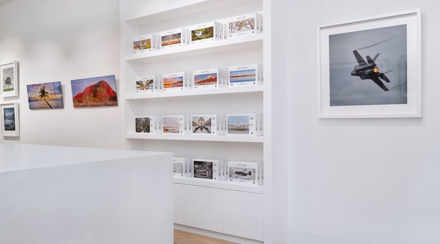 A collection of artworks including aviation images as as jigsaw puzzles on display at the Scott Leggo Gallery.