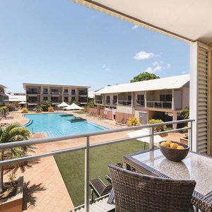 Private balcony with views of the resort grounds and pool area