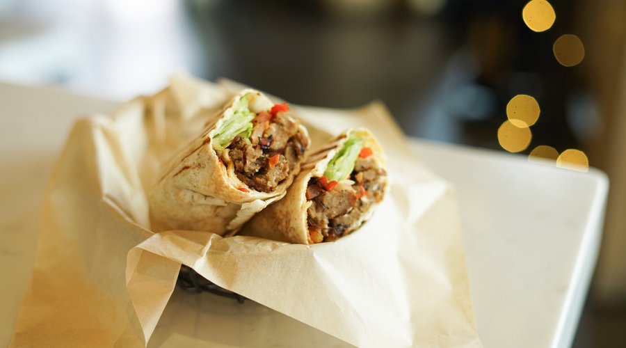 ShawarmBaa - Juicy lamb stuffed in a pita wrap with lettuce, tomatoes, onions, and peppers dressed with tzatziki.