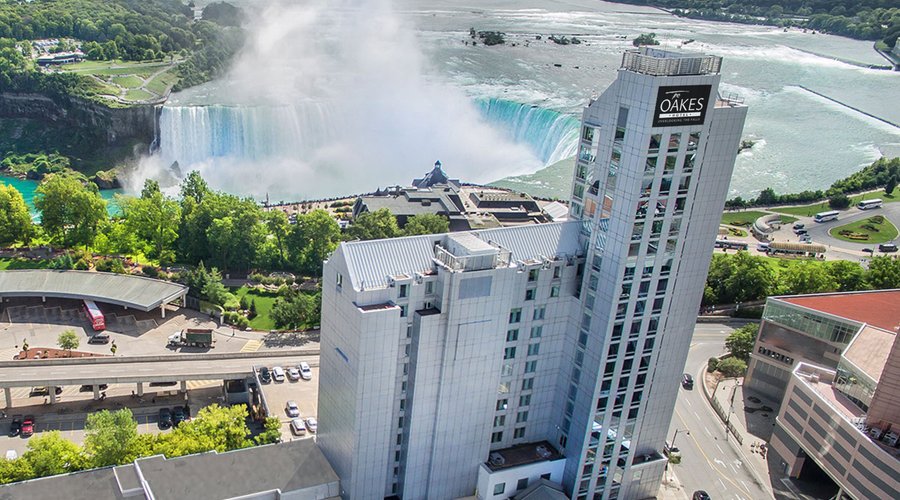 Exterior photo of the Oakes Hotel and Niagara's Horseshoe Falls.