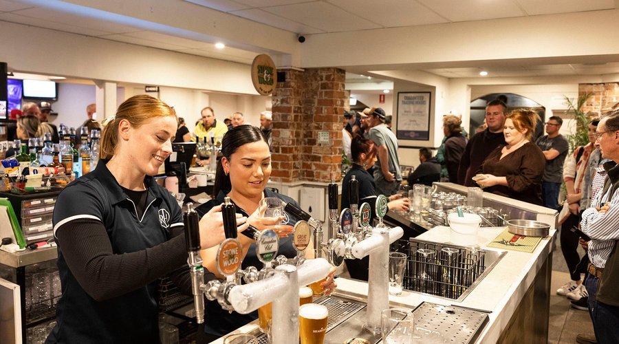 Experience the lively atmosphere of our bustling bar, where our dedicated staff keeps the good times flowing.