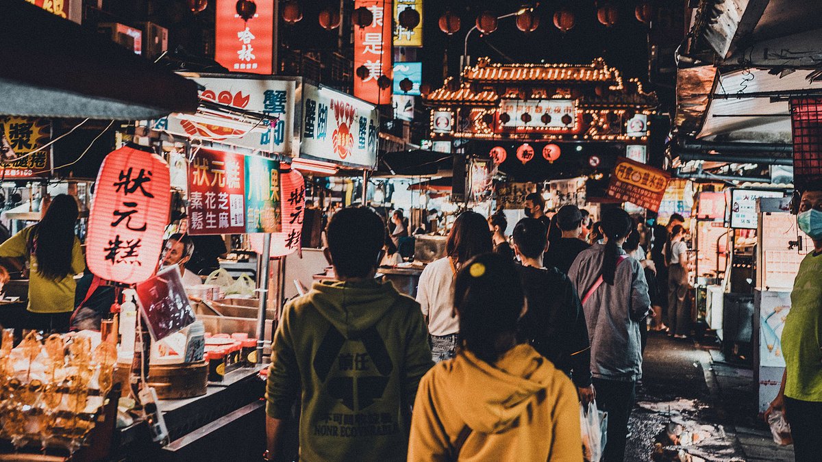Tourists visit night market in Taipei