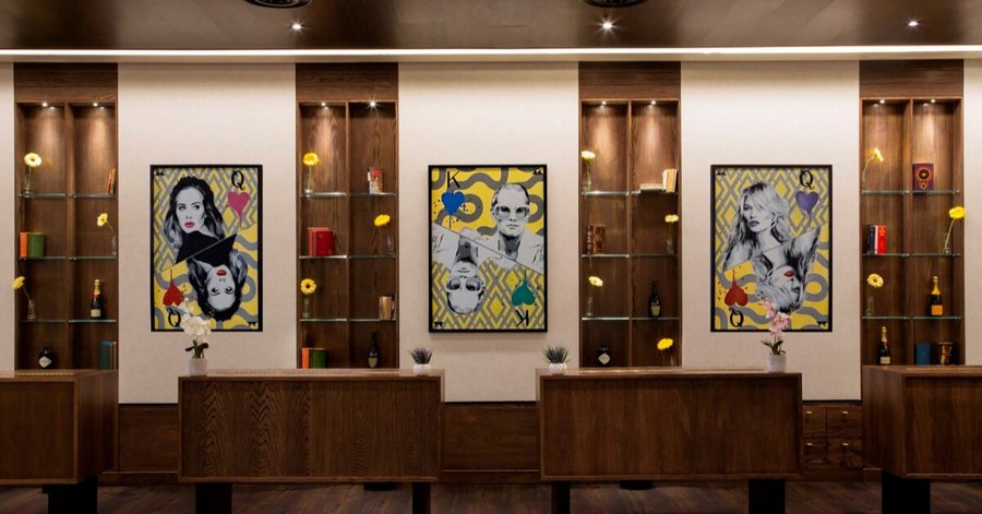 St Giles London Hotel lobby featuring a modern design and bespoke artwork from the hotel's artist in residence, renowned artist Pegasus. 